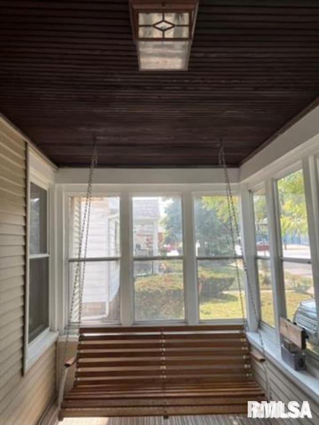 unfurnished sunroom featuring a healthy amount of sunlight