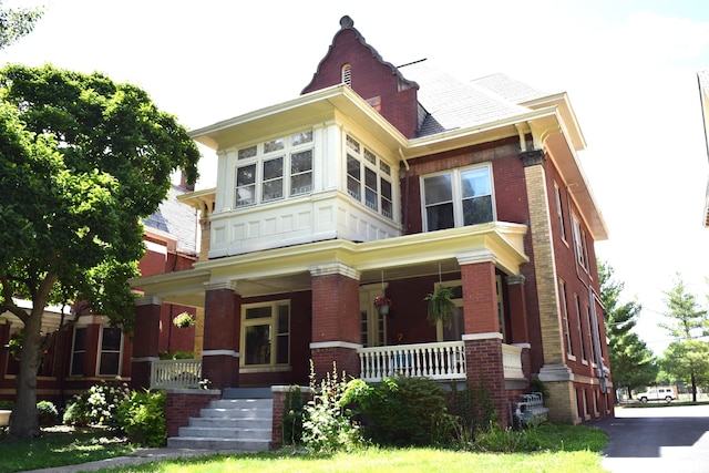 victorian house featuring a porch