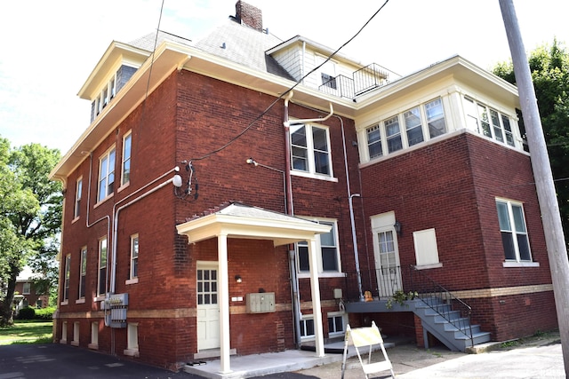 rear view of house with a balcony