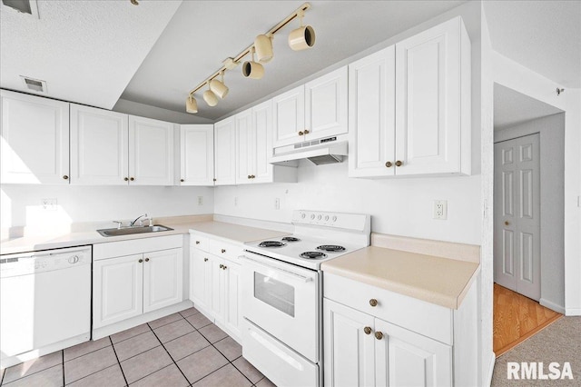 123 SW Jefferson Ave Unit E3S, Peoria, IL 61602 - kitchen featuring light tile patterned flooring, a textured ceiling, sink, white cabinets, and white appliances