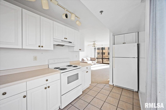 123 SW Jefferson Ave Unit E3S, Peoria, IL 61602 - kitchen featuring a textured ceiling, light tile patterned floors, ceiling fan, white cabinetry, and white appliances