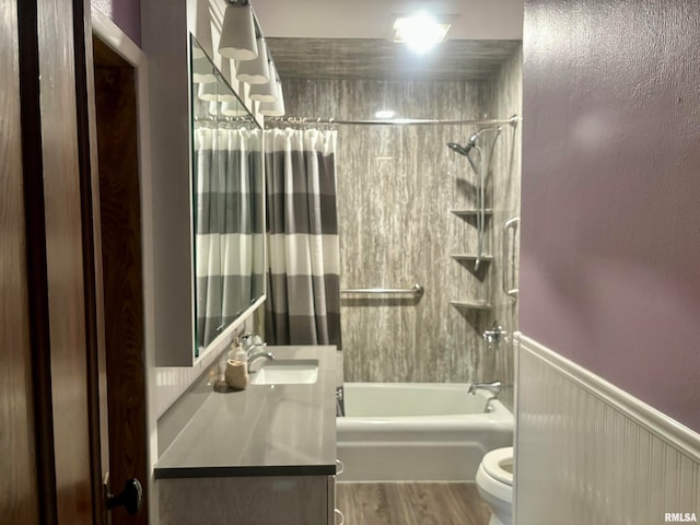 full bathroom featuring vanity, wood-type flooring, toilet, and shower / tub combo with curtain