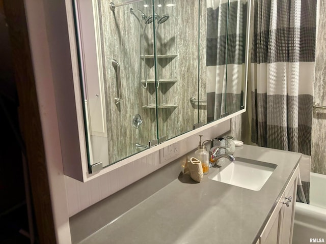 bathroom with walk in shower and vanity