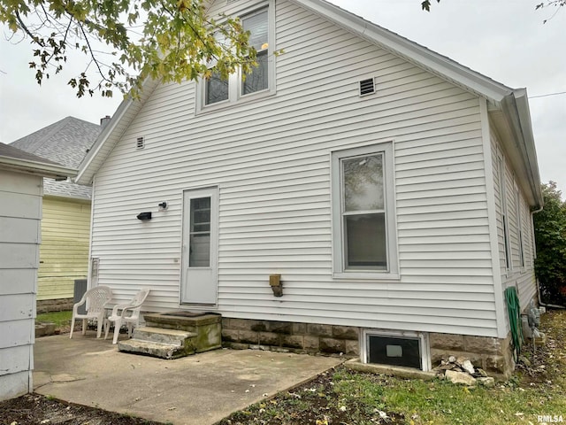 rear view of property with a patio area