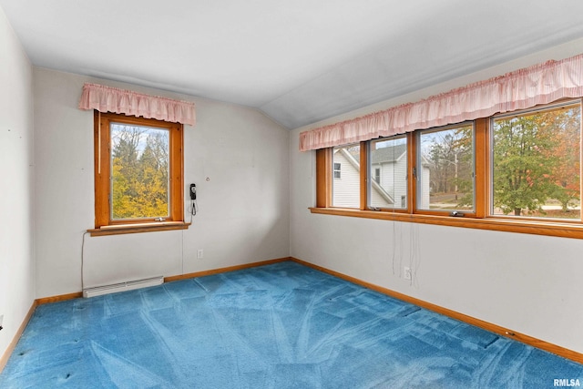 unfurnished room with lofted ceiling, carpet floors, and a baseboard heating unit