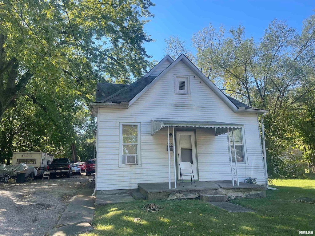 bungalow with a front yard