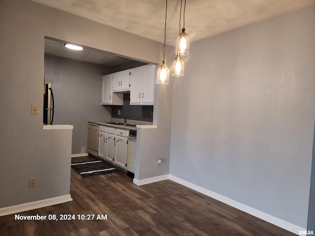 kitchen with dark wood-type flooring, white cabinets, dishwasher, sink, and decorative light fixtures