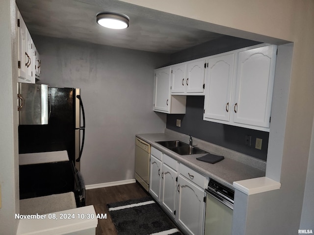 kitchen featuring sink, white cabinets, stainless steel fridge, dark wood-type flooring, and dishwasher