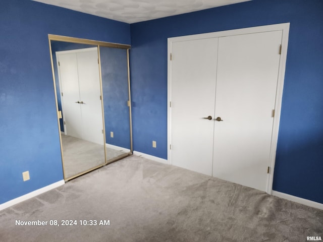 unfurnished bedroom with carpet floors