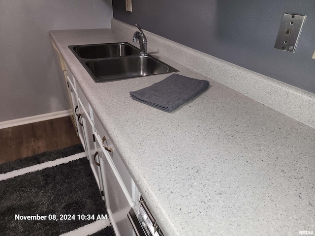 kitchen with sink and wood-type flooring