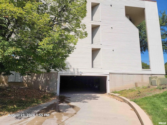 view of side of home featuring a garage