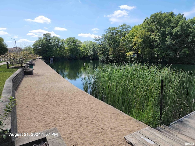 surrounding community featuring a water view