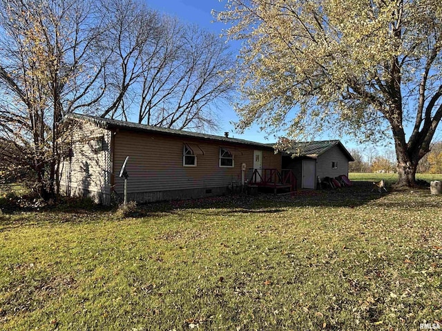 300 W Bobbi Ln, Vermont, IL 61484 - rear view of property with a lawn and a deck