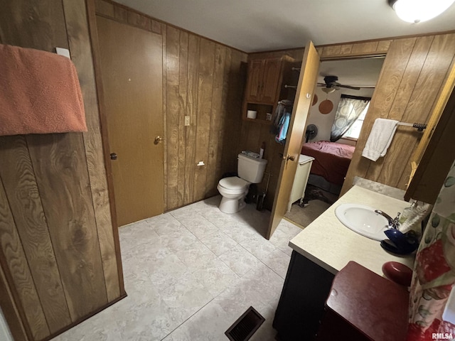 300 W Bobbi Ln, Vermont, IL 61484 - bathroom featuring wooden walls, toilet, vanity, ensuite bath, and ceiling fan