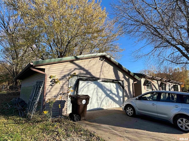 view of side of home with a garage