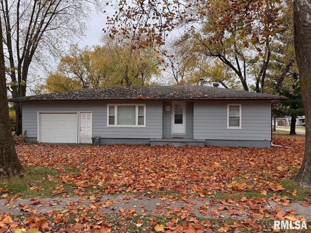 ranch-style home with a garage