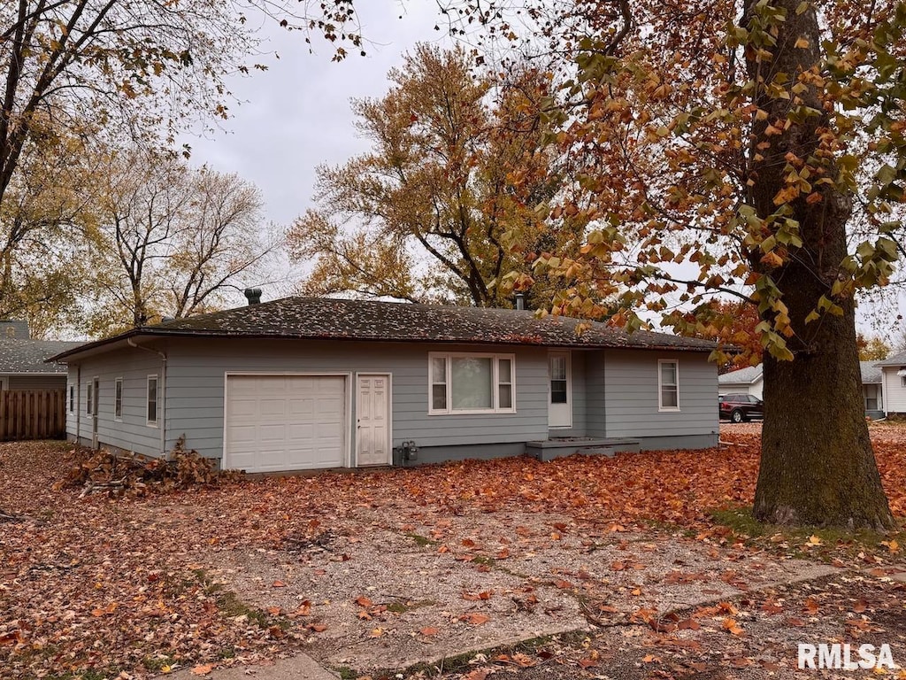 ranch-style home with a garage