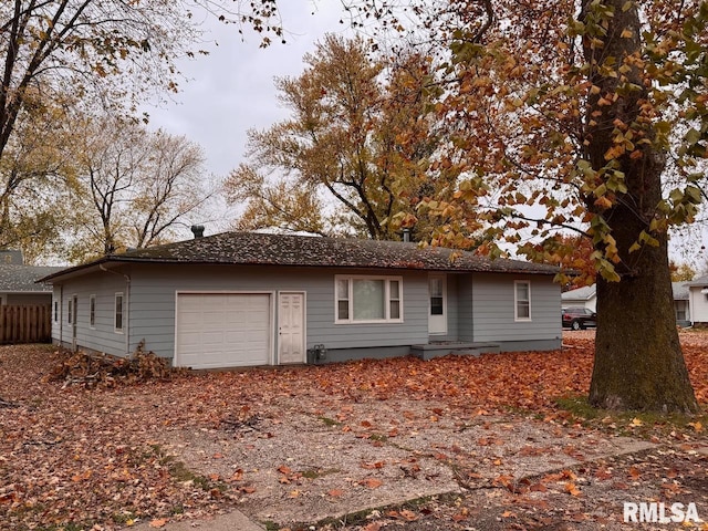 ranch-style home with a garage