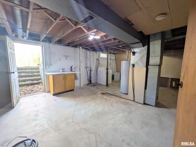 basement with washing machine and clothes dryer and water heater