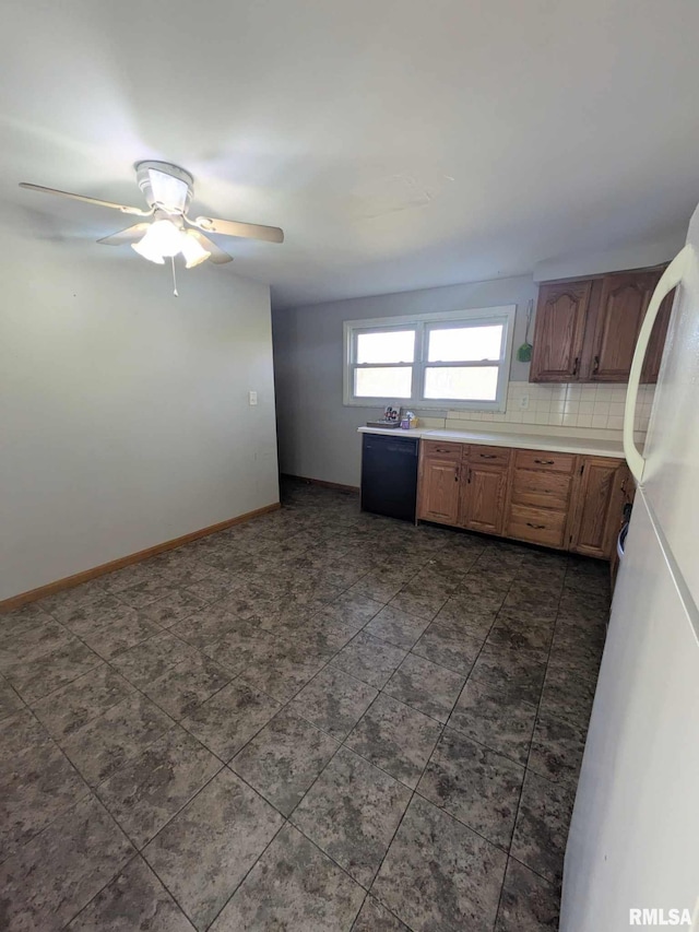 kitchen with ceiling fan, black dishwasher, and tasteful backsplash