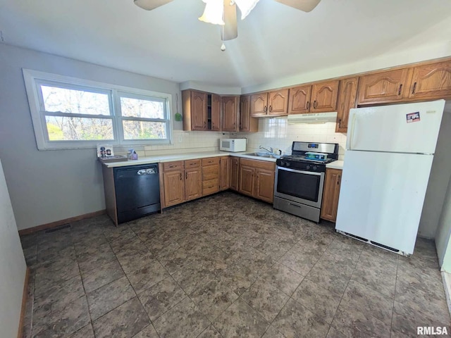 kitchen featuring backsplash, ceiling fan, sink, and white appliances