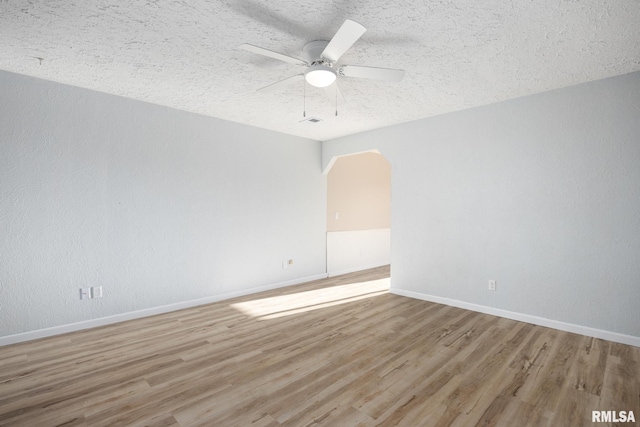 spare room with wood-type flooring, a textured ceiling, and ceiling fan