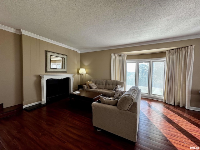 2001 Wigwam Hollow Rd, Macomb, IL 61455 - living area featuring a fireplace, crown molding, a textured ceiling, and dark wood-type flooring