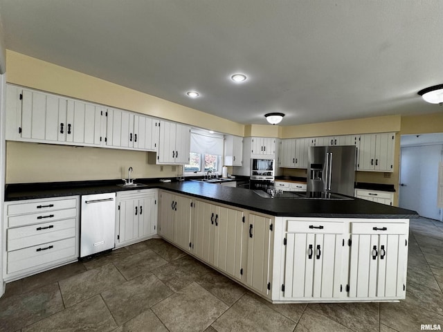 2001 Wigwam Hollow Rd, Macomb, IL 61455 - kitchen featuring black appliances, dark countertops, and white cabinetry