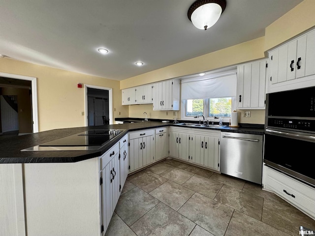 kitchen featuring white cabinetry, appliances with stainless steel finishes, and sink