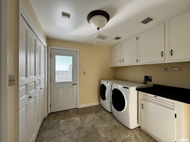 2001 Wigwam Hollow Rd, Macomb, IL 61455 - laundry room with cabinet space, washing machine and clothes dryer, and light stone finish floors
