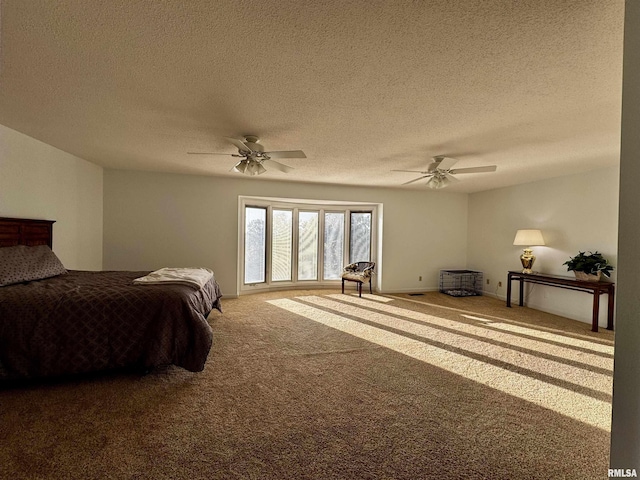 2001 Wigwam Hollow Rd, Macomb, IL 61455 - bedroom featuring carpet flooring, a textured ceiling, and a ceiling fan