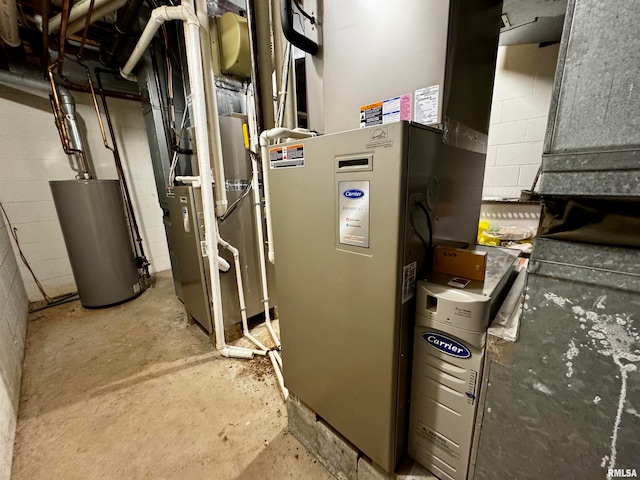 utility room featuring gas water heater and heating unit