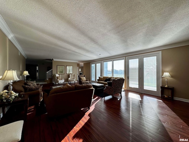 living room with a textured ceiling, dark hardwood / wood-style flooring, and crown molding