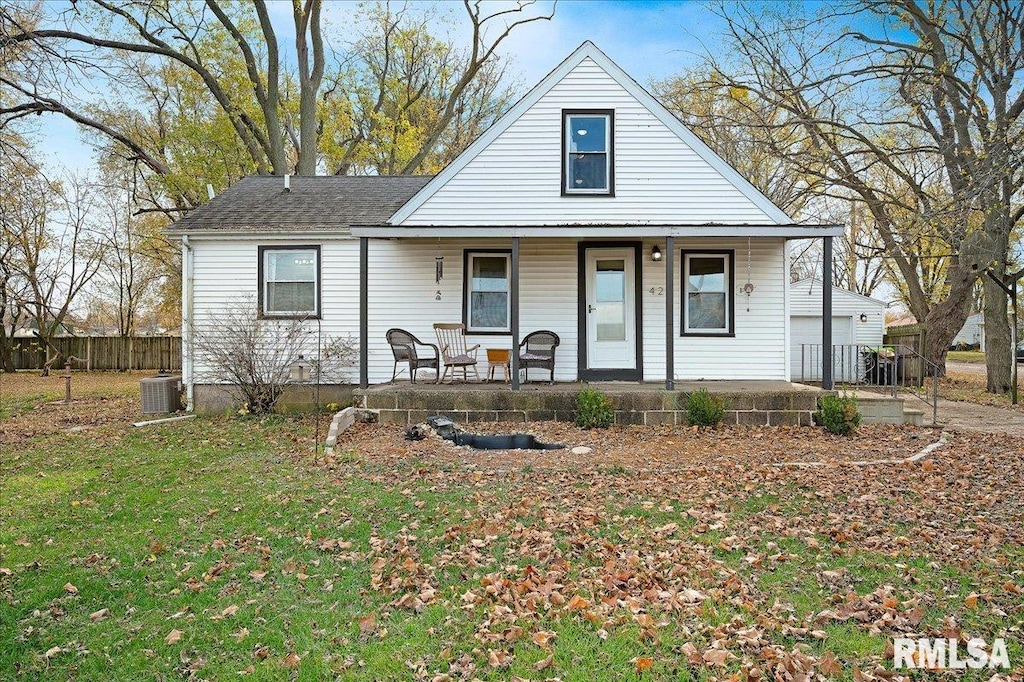 view of front of home with covered porch and a front yard