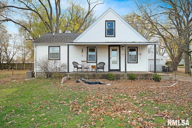 view of front of home with covered porch and a front yard