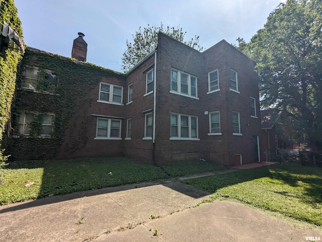 view of home's exterior featuring a lawn