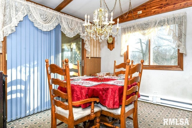 dining space featuring lofted ceiling and an inviting chandelier