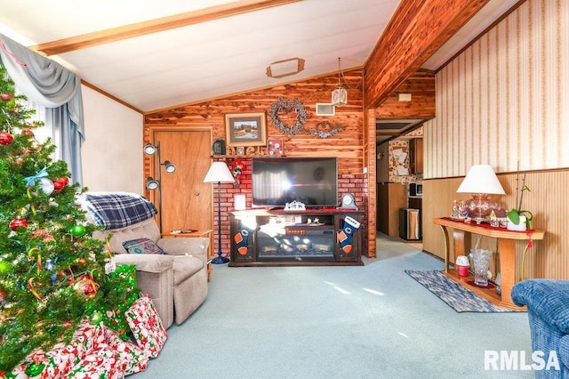 living room featuring wood walls, carpet floors, and lofted ceiling with beams