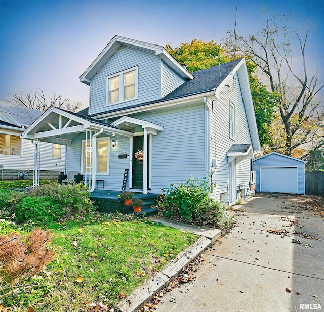 view of front facade featuring an outbuilding and a garage