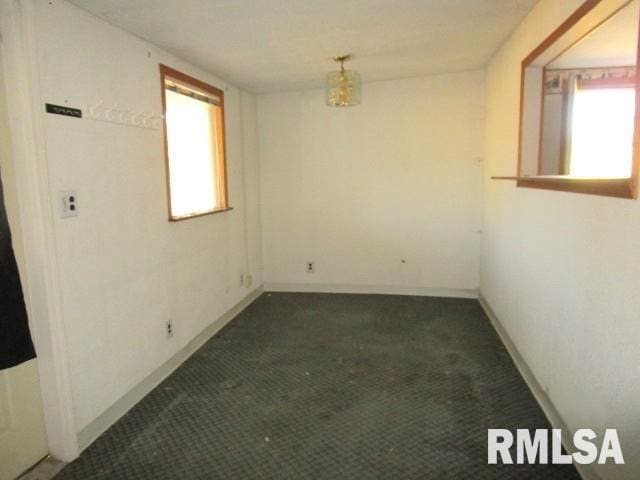 410 W Illinois St, Spring Bay, IL 61611 - carpeted empty room with baseboards