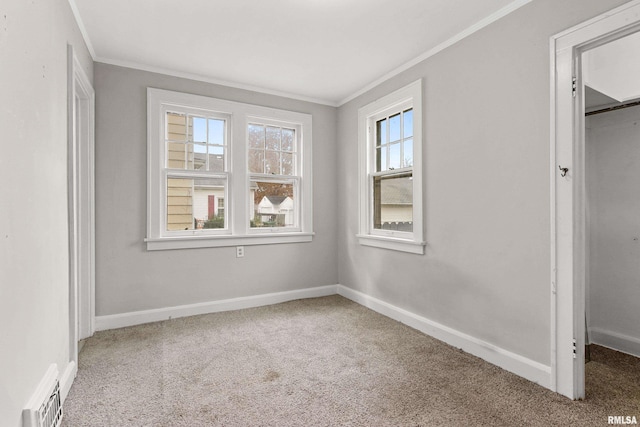 unfurnished bedroom featuring carpet and crown molding