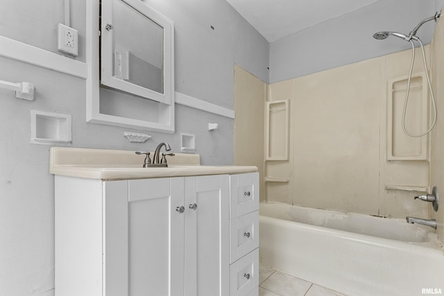 bathroom featuring vanity, tile patterned floors, and shower / washtub combination