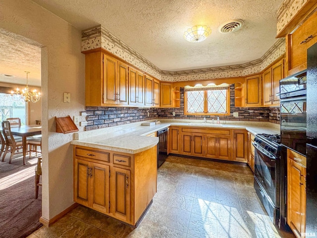 kitchen featuring a wealth of natural light and a textured ceiling