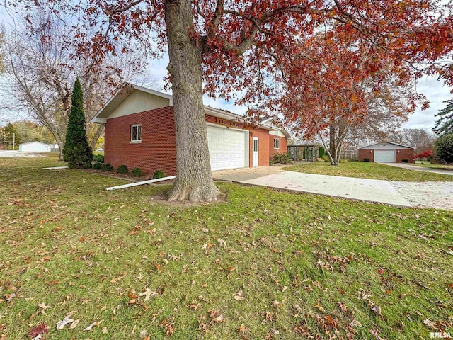 view of side of home with a yard