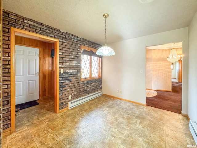 unfurnished dining area with brick wall, a chandelier, a textured ceiling, and a baseboard radiator