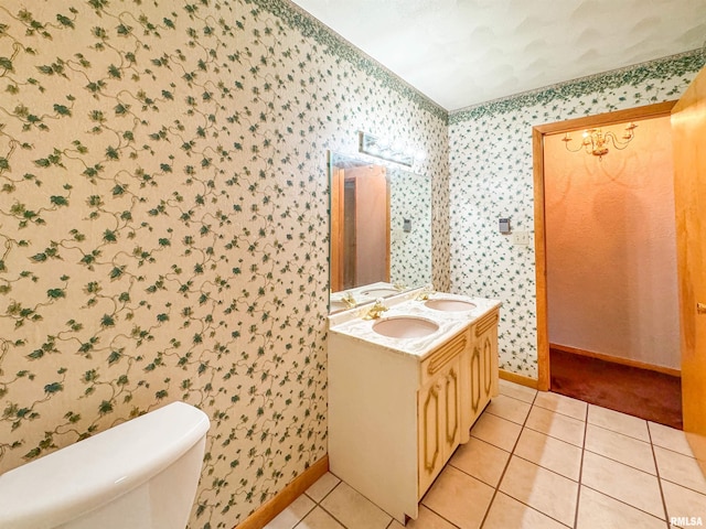 bathroom with vanity, tile patterned floors, and toilet