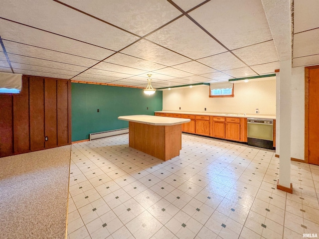 kitchen featuring dishwasher, a kitchen island, and a baseboard radiator