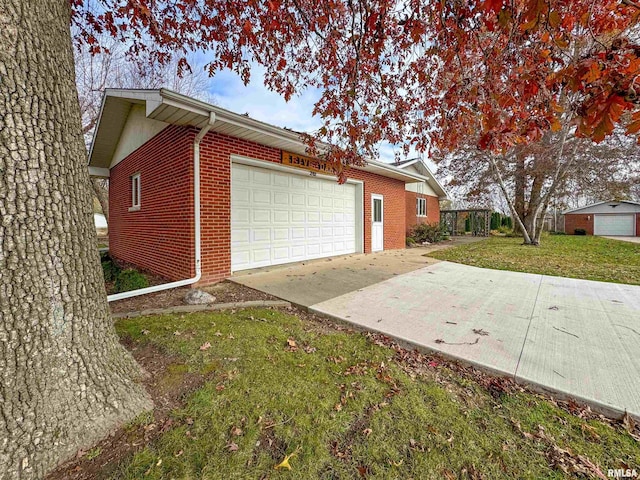 view of home's exterior featuring a garage and a yard