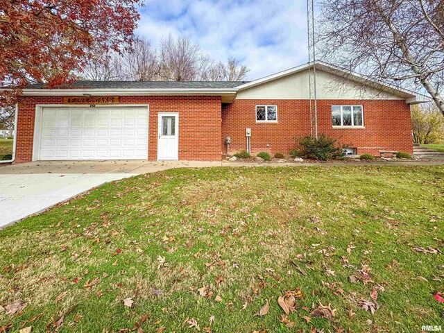 view of home's exterior with a lawn and a garage