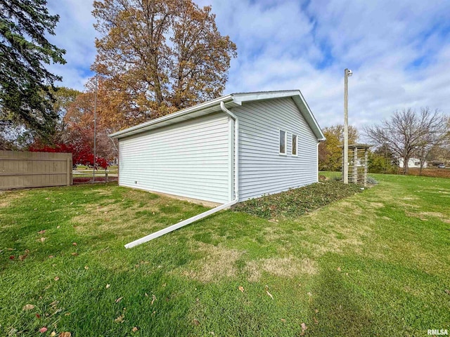 garage featuring a yard